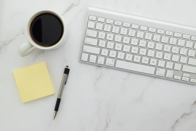 Wireless keyboard on a marble desk