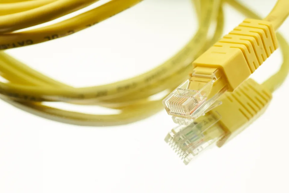 Yellow network cable with RJ45 connector